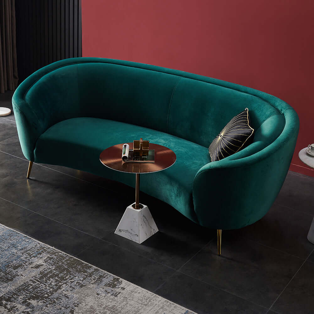 Stylish deep green upholstered sofa with sturdy metal legs for modern interior design