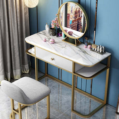 Small gold makeup vanity table with faux marble tabletop, mirror, and drawer