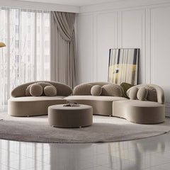 Modern beige velvet upholstered 7-seat sofa with ottoman and pillows for living room