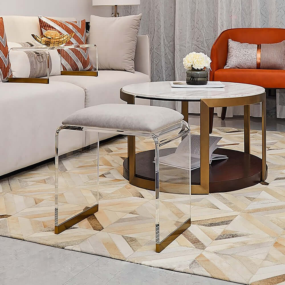 Modern gray acrylic ottoman vanity stool featuring clear and gold accents