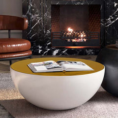 Contemporary white drum coffee table featuring hollow interior storage and yellow top