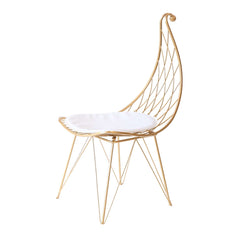 Sleek gold finish dining chair with hollow metal base and cushioned PU leather seat