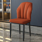 Modern dining chair with high back and black legs upholstered in PU leather