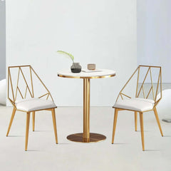 Set of 4 modern white dining chairs with sleek PU leather upholstery and stylish golden geometric frames