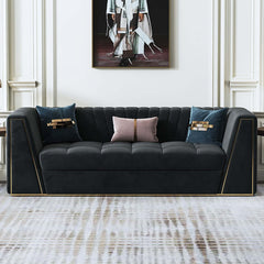 Modular velvet couch with deep gray tufted upholstery