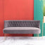 Mid-century 3-seater green velvet sofa with elegant button tufted chesterfield back design