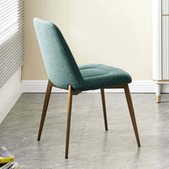 Chic set of 2 green upholstered dining chairs adding modern elegance to any dining space