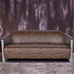 Vintage brown PU leather sofa with aviator design and nailhead trim