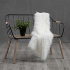 Rustic wooden bench with comfortable backrest and armrests for outdoor seating