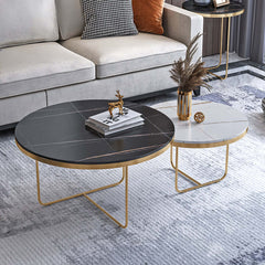 Chic 2-piece coffee table set with black and white stone tops and gold bases for contemporary interior styling