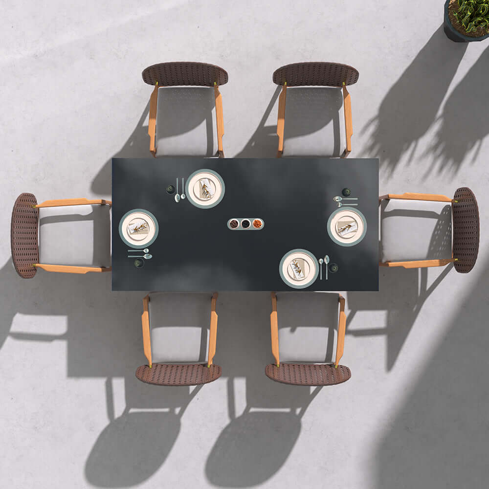 Teak wood dining set with glass top table and natural rattan armchair