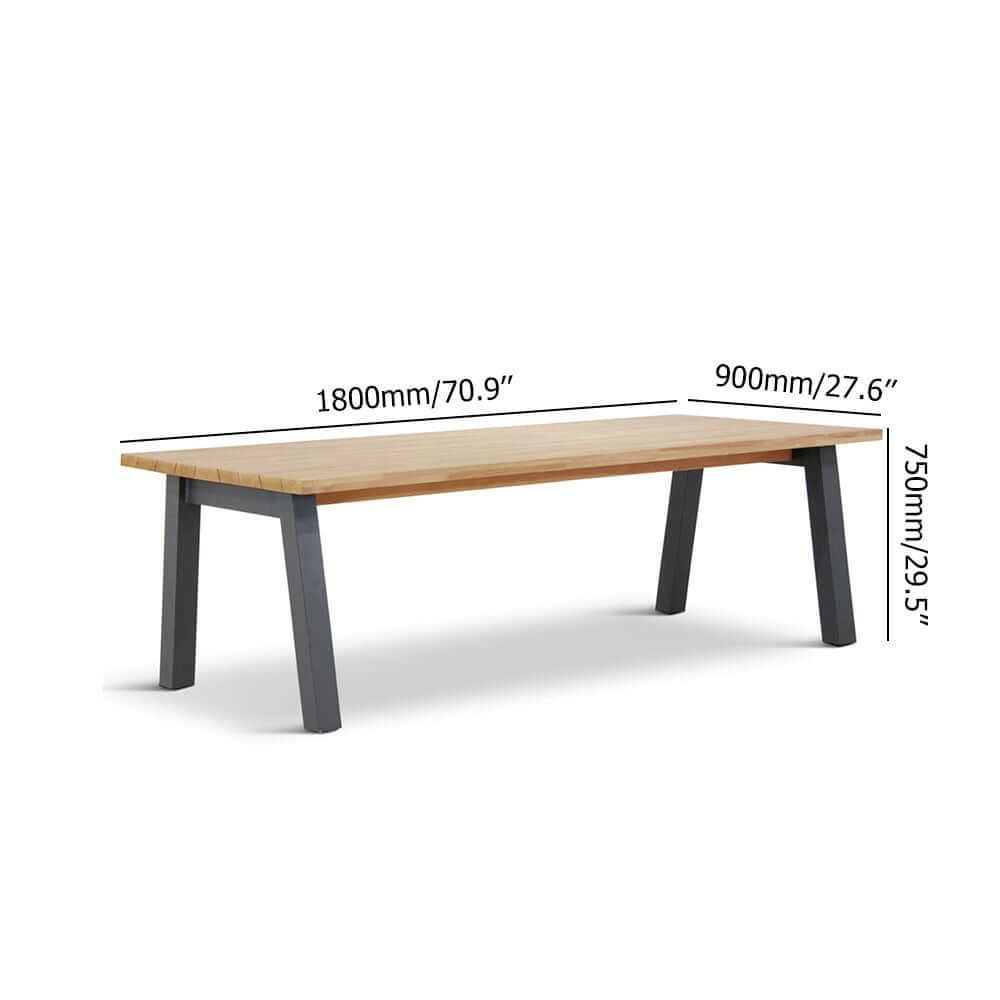 Rustic outdoor dining set with teak wooden table and rattan armchairs for a cozy outdoor dining experience