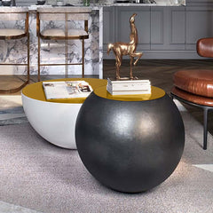 Modern white round drum coffee table with hollow interior storage and yellow top