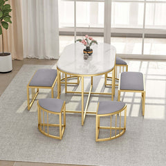 Elegant white oval dining table and stools with stone top and metal frame for luxurious dining experience