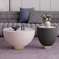 Gray drum coffee table with stone round top and PU leather accent, adding contemporary charm to home decor