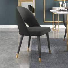 Elegant upholstered blue dining chair with a sleek curved back, perfect for a set of 2