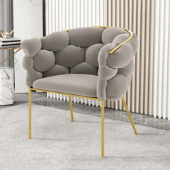 Gray velvet upholstery chair with tufted detailing and modern Nordic design