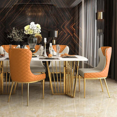 Pair of contemporary orange side chairs with wingback, upholstered in PU leather