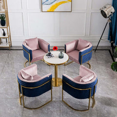 Luxurious pink and blue velvet barrel chair with opulent gold accents