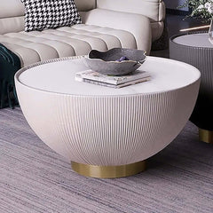 Versatile gray drum coffee table with stone round top and PU leather accent, ideal for modern living spaces