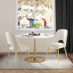 Pair of stylish black upholstered dining chairs with hollow back and metallic gold legs