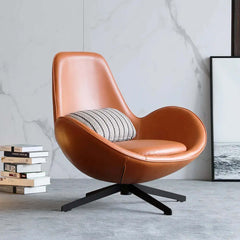 Contemporary brown egg lounge chair featuring faux leather upholstery and durable metal base