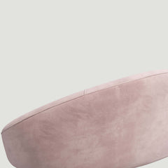 Stylish pink velvet sofa with curved design, gold metal base, and included toss pillow, 63 inch length