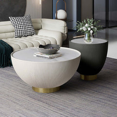 Stylish gray drum coffee table with stone round top and PU leather accent for elegant home decor