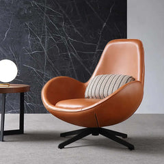 Chic brown egg lounge chair accented with faux leather upholstery and a modern metal base