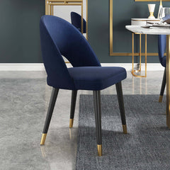 Modern blue velvet dining chair with curved back and comfortable upholstery, set of 2