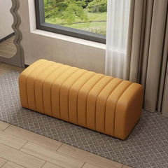 Channel tufted orange leather bench with modern design, perfect for entryway