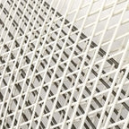 Outdoor PE rattan loveseat with metal legs and cushion pillows for patio seating