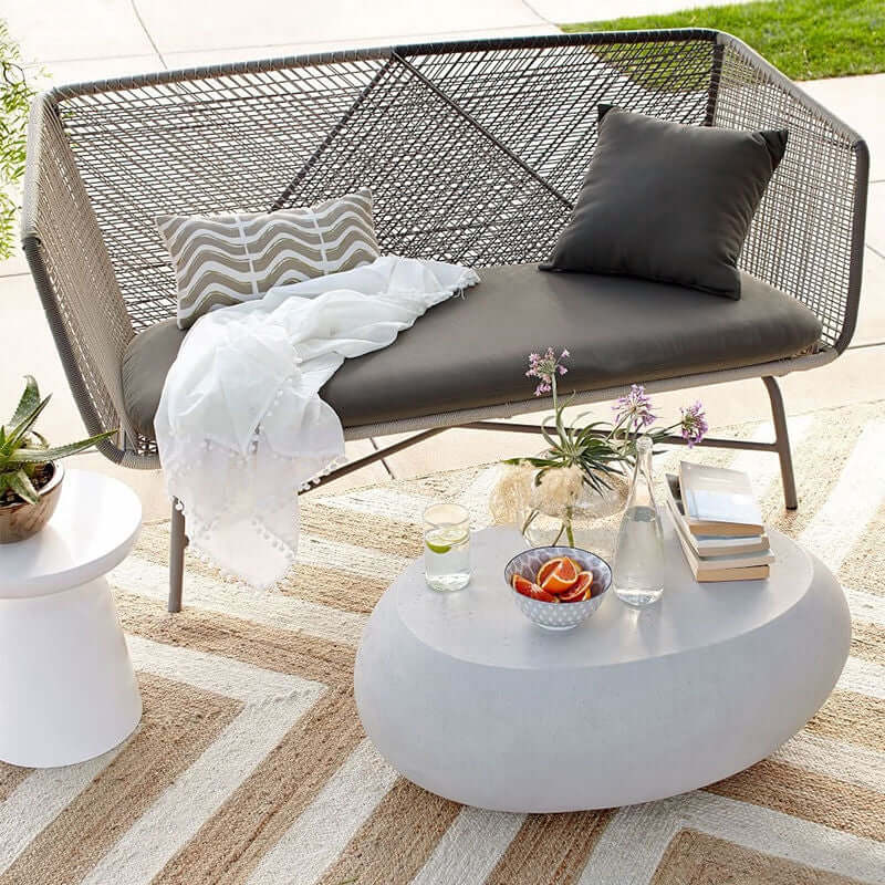 Outdoor PE rattan loveseat with metal legs and cushion pillows for patio seating
