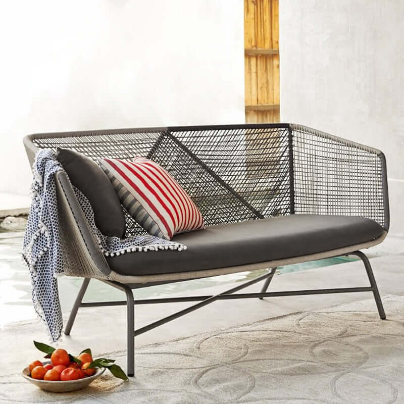 Outdoor PE rattan loveseat with metal legs and cushion pillows for patio seating